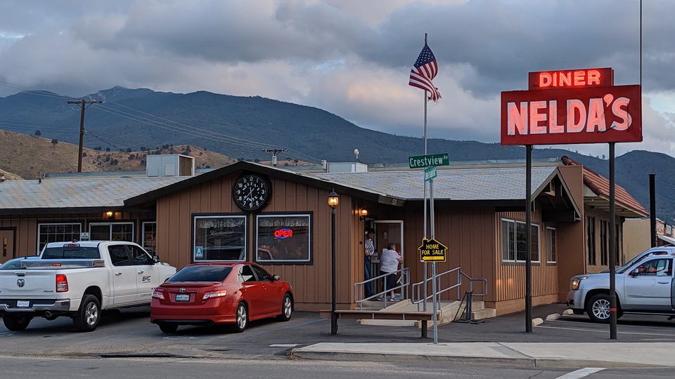 Casual diner tables with warm seating.