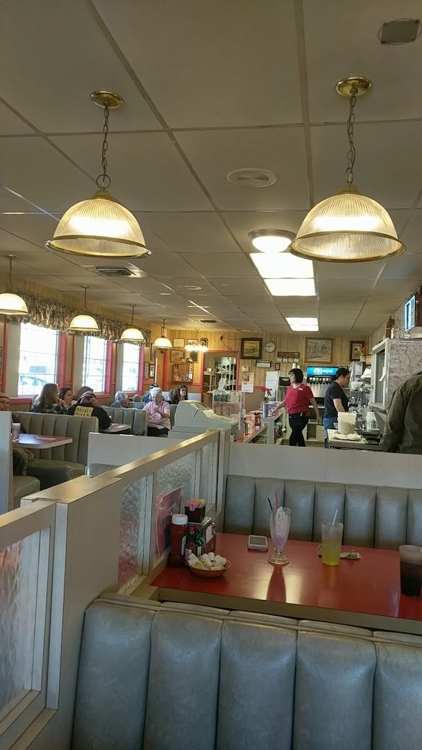 Casual diner tables with warm seating.